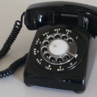 a black rotary dial telephone